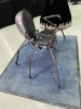 WGT: a steel chair in the shape of a spider by vendor Lucas Haupt